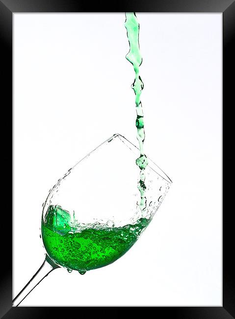 A glass of Green sparkling water Framed Print by Dave Frost
