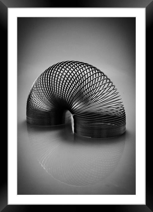 Slinky Framed Mounted Print by mike Davies