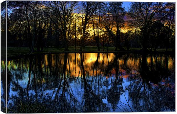 Sunset over the Pond Canvas Print by Dean Messenger