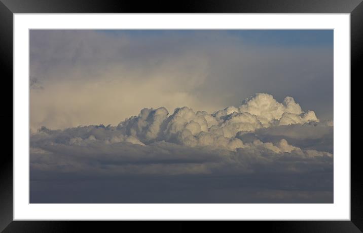 raging clouds Framed Mounted Print by simon plumridge