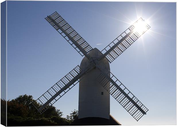 Sunlight through the Windmill Canvas Print by Dean Messenger