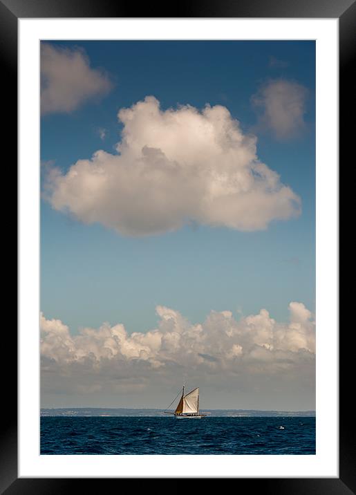 Sailing boat and cloud Framed Mounted Print by Gary Eason