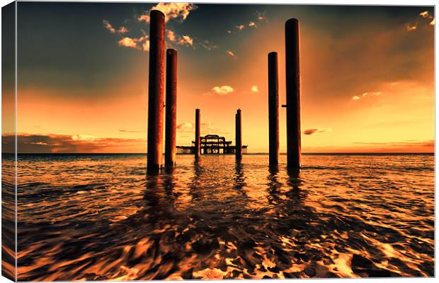 sunset across brighton pier Canvas Print by Dean Messenger