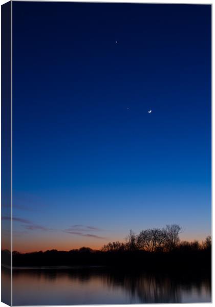 Jupiter, Venus and the Moon over the lake Canvas Print by Mark Chance