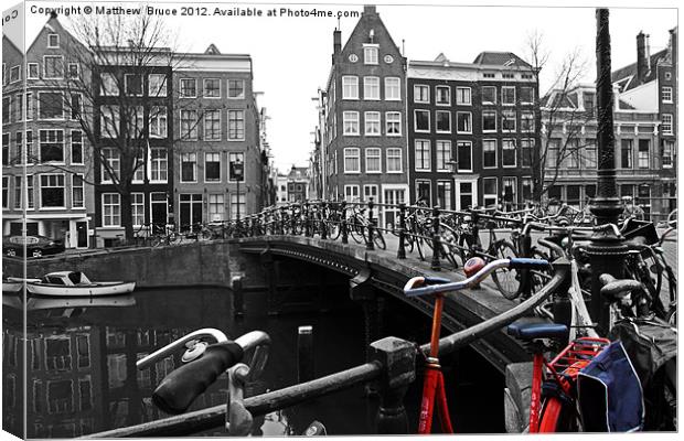 Red bike in Amsterdam Canvas Print by Matthew Bruce