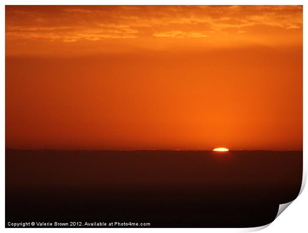 Sun disappearing under the horizon Print by Valerie Brown