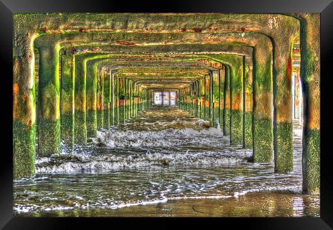 Under Walton on the naze Pier Framed Print by martin eccles