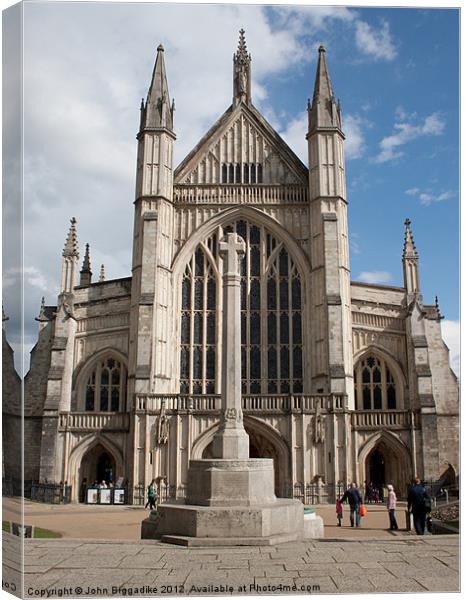 Winchester Cathedral and monument Canvas Print by John Biggadike