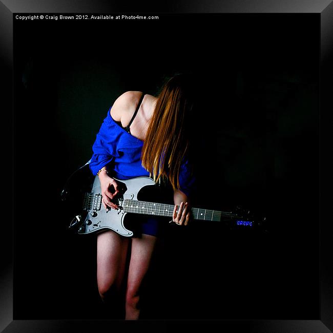 Woman Plays Guitar Framed Print by Craig Brown