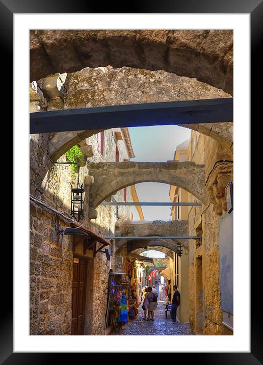 An alley in Rhodes Town Framed Mounted Print by Tom Gomez