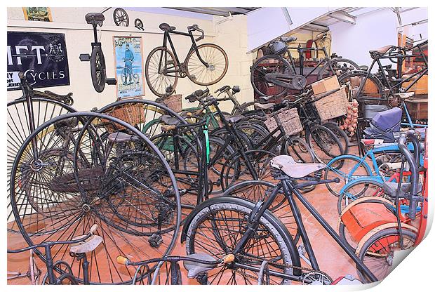 A Muddle of Old Bicycles Print by Julie Ormiston