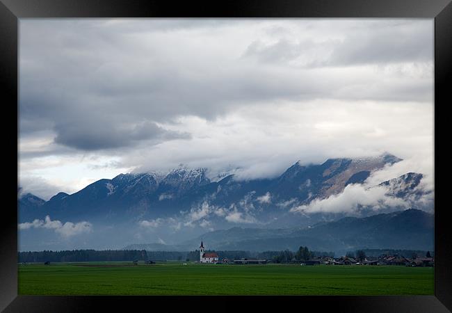 The Kamnik Alps after a storm Framed Print by Ian Middleton