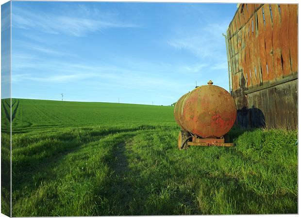 Old oil tanker by burned out barn Canvas Print by Alison Jackson