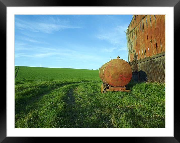 Old oil tanker by burned out barn Framed Mounted Print by Alison Jackson