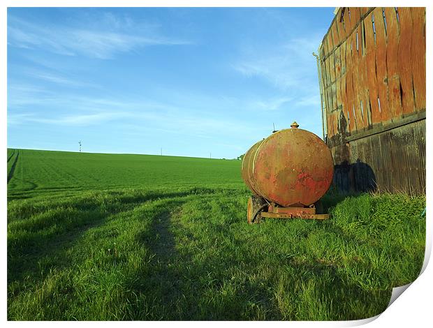 Old oil tanker by burned out barn Print by Alison Jackson