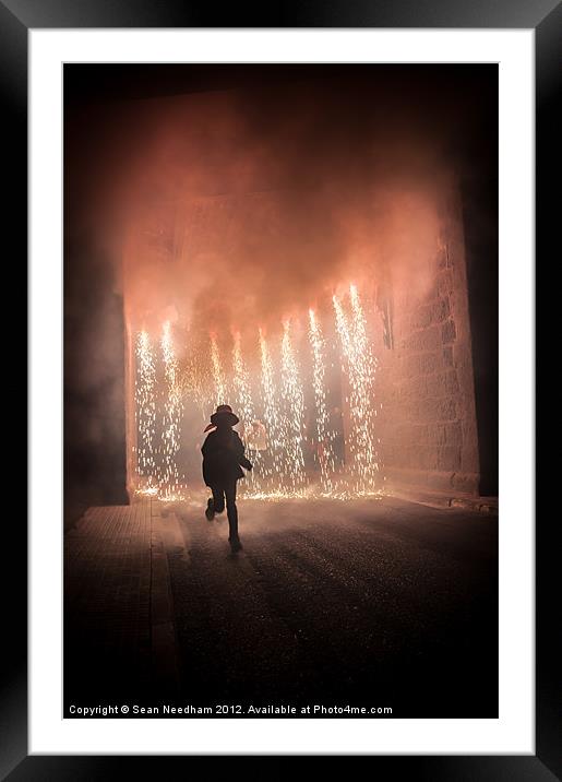 Running through the fire. Framed Mounted Print by Sean Needham
