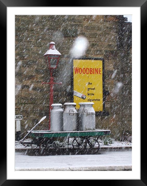 Goathland Station and snow Framed Mounted Print by John Taylor