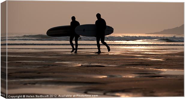 Surfers at Sunset Canvas Print by Helen Northcott