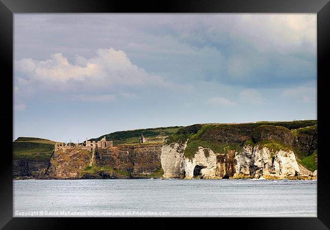 Cliff and castle Framed Print by David McFarland