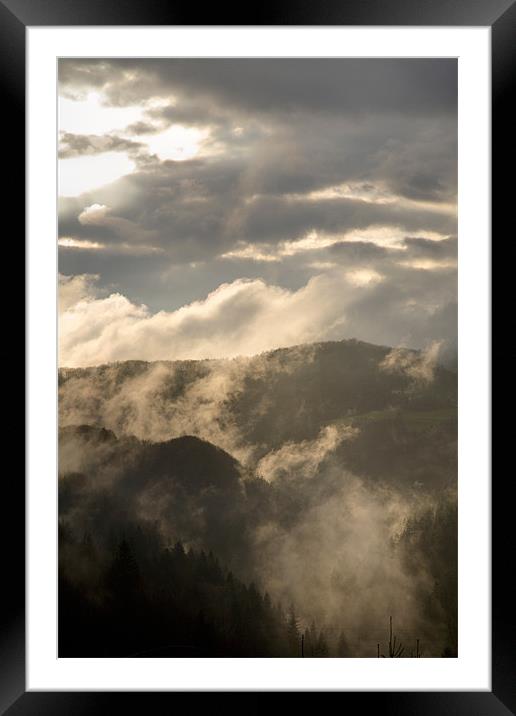 Storm clouds gather over mountains Framed Mounted Print by Ian Middleton
