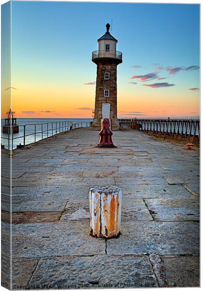 Witby East Pier and Lighthouse Canvas Print by Martin Williams