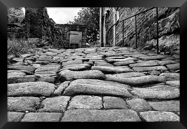 cobbled street in Heptonstall Framed Print by simon sugden