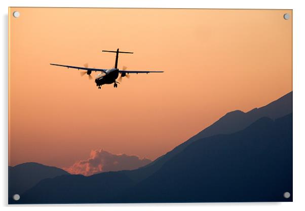 Airplane landing at sunset Acrylic by Ian Middleton