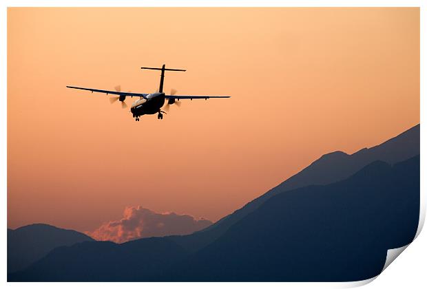 Airplane landing at sunset Print by Ian Middleton
