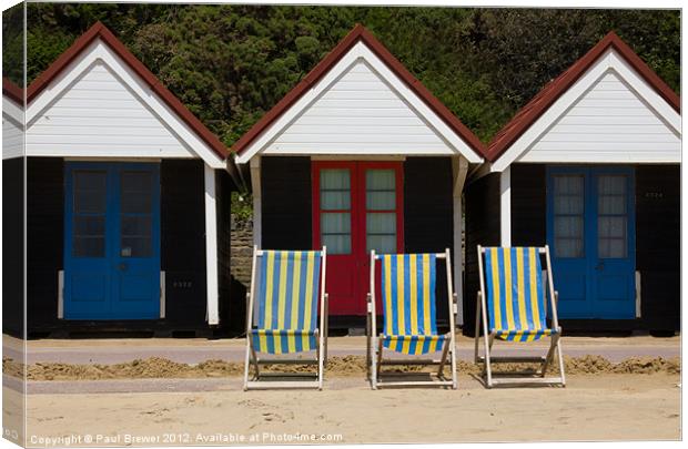 Beach Huts and Deck chairs Canvas Print by Paul Brewer