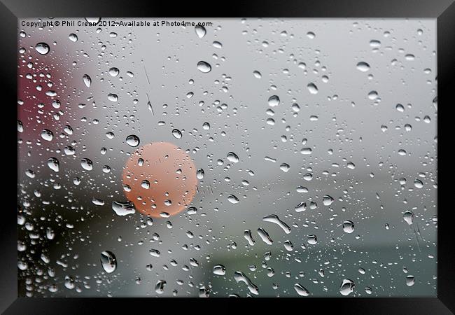 Raindrops and orange circle on window Framed Print by Phil Crean