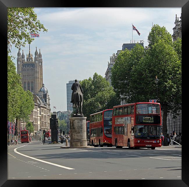 Red London bus in Whitehall Framed Print by Tony Murtagh