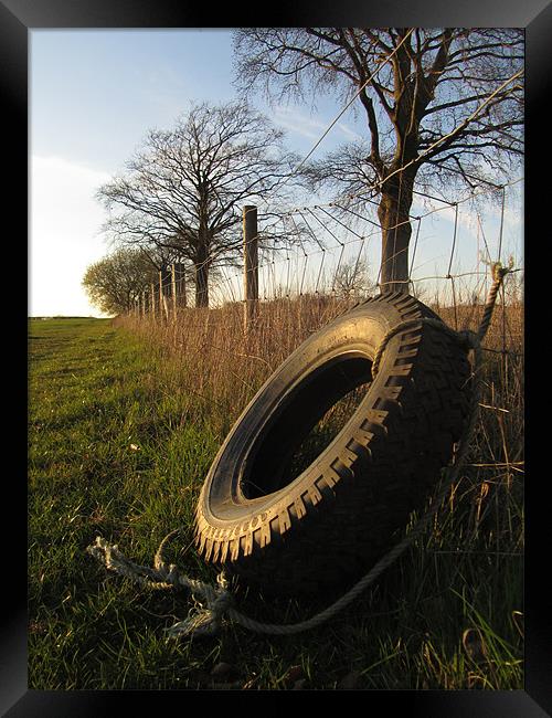 tire at sunset Framed Print by isaac ford