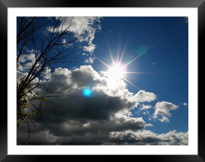 Sun and Clouds Framed Mounted Print by Donna Duclos