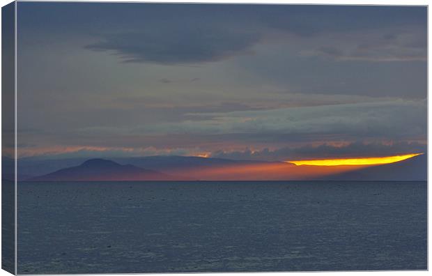 Holy Isle Sunset Rays Canvas Print by David Hancox