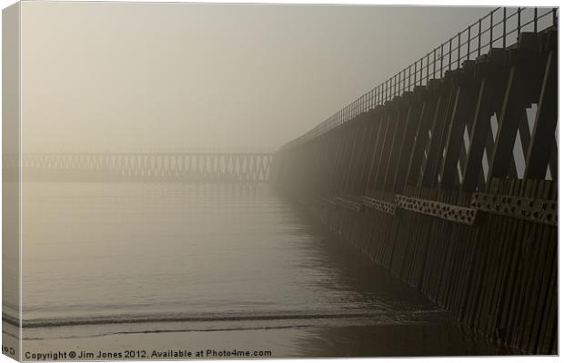 Wooden Pier in the mist Canvas Print by Jim Jones