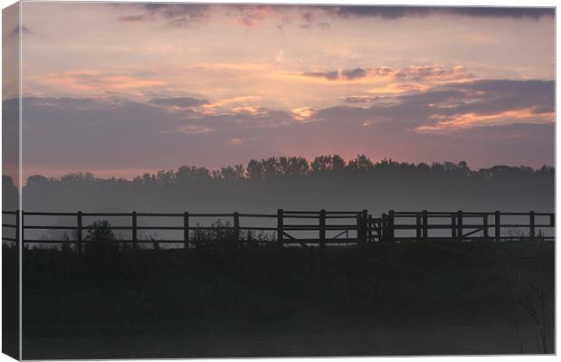 misty morning sunrise Canvas Print by mark pettican