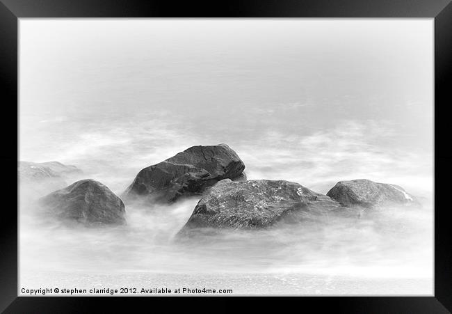 Long exposure waves on rocks Framed Print by stephen clarridge