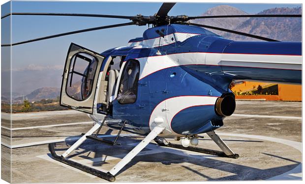 Blue and White helicopter on helipad Canvas Print by Arfabita  