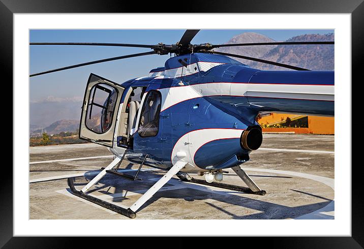 Blue and White helicopter on helipad Framed Mounted Print by Arfabita  