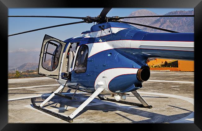 Blue and White helicopter on helipad Framed Print by Arfabita  
