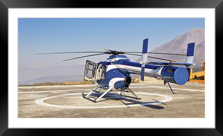 Helicopter ready for takeoff from helipad Framed Mounted Print by Arfabita  