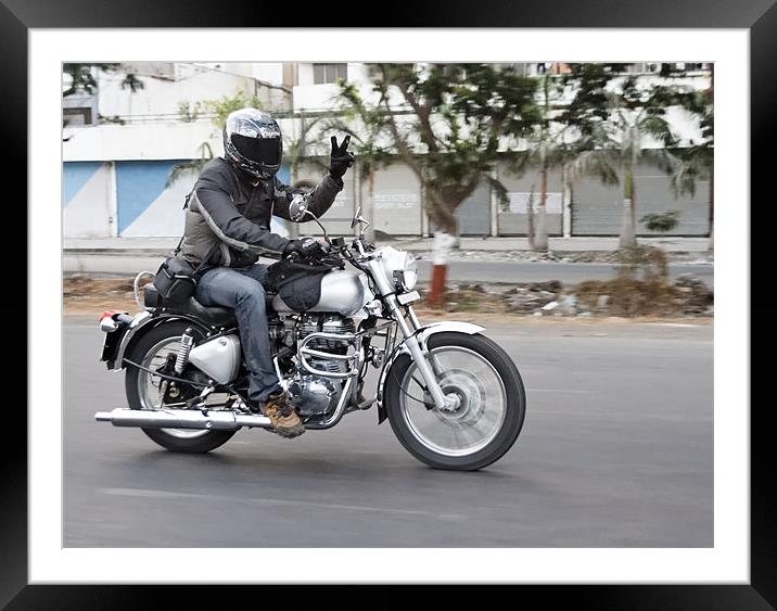Motorbiker motion showing peace sign Framed Mounted Print by Arfabita  