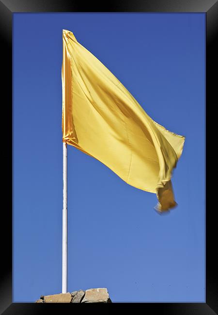 Yellow flag fluttering in blue sky Framed Print by Arfabita  