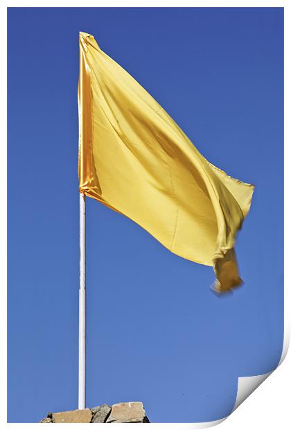 Yellow flag fluttering in blue sky Print by Arfabita  