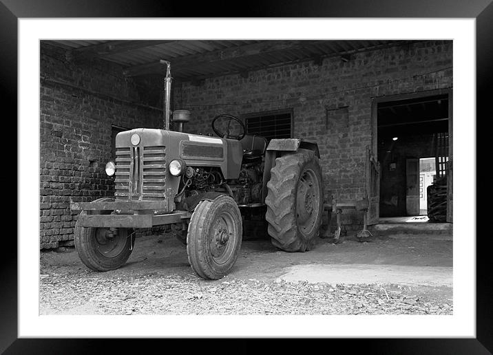 Tractor at home stable Framed Mounted Print by Arfabita  
