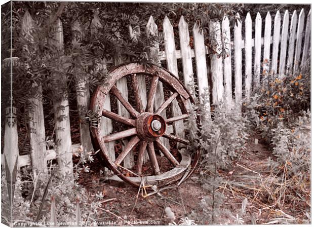 Picket Fence Cart wheel Canvas Print by Luke Newman