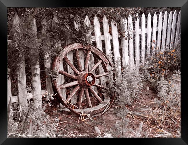 Picket Fence Cart wheel Framed Print by Luke Newman