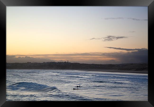 Surfing at Daybreak Framed Print by Kieran Brimson