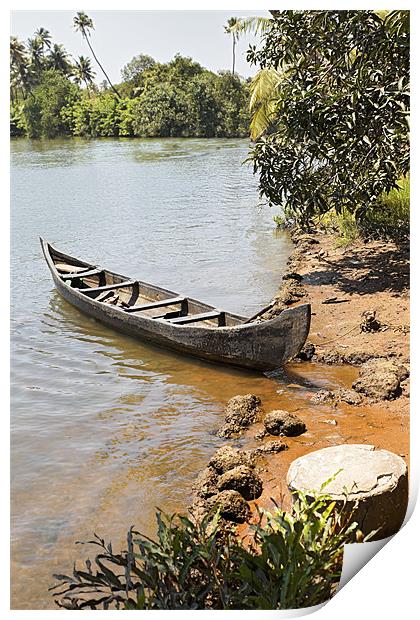 Canoe moored on sandy bank Print by Arfabita  