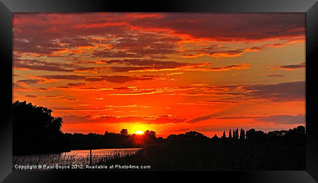 Sun setting Over Oulton Marsh Framed Print by Paul Boyce